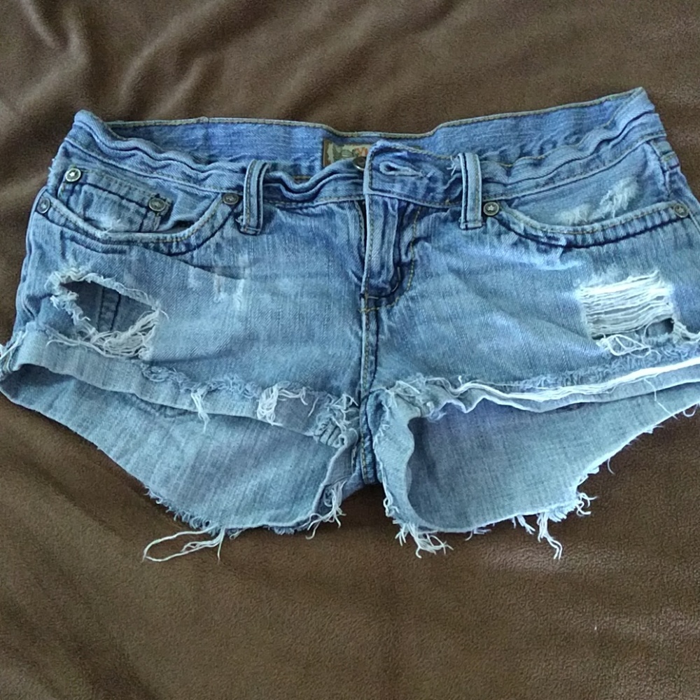 Distressed blue jean shorts